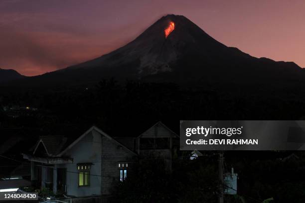 Lava spews out of Mount Merapi, Indonesia's most active volcano, as seen from the Kaliurang Selatan village in Srumbung, Magelang, Central Java on...