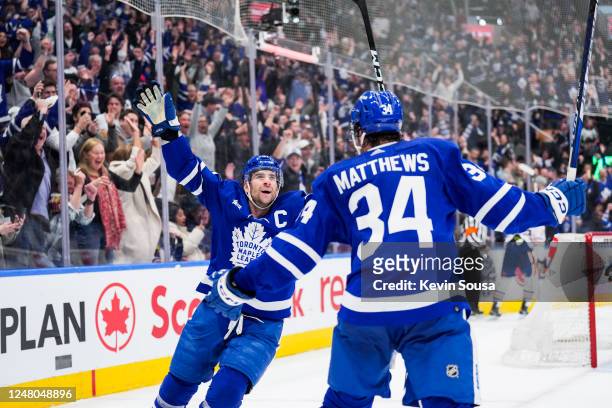 John Tavares of the Toronto Maple Leafs celebrates his goal against the Edmonton Oilers with teammate Auston Matthews during the second period at the...