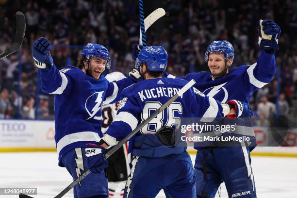 Brayden Point of the Tampa Bay Lightning celebrates the game winning goal with teammates Nikita Kucherov and Mikhail Sergachev against the Chicago...