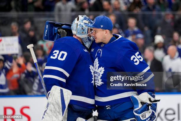 Matt Murray of the Toronto Maple Leafs celebrates with teammate Ilya Samsonov after defeating the Edmonton Oilers at the Scotiabank Arena on March...