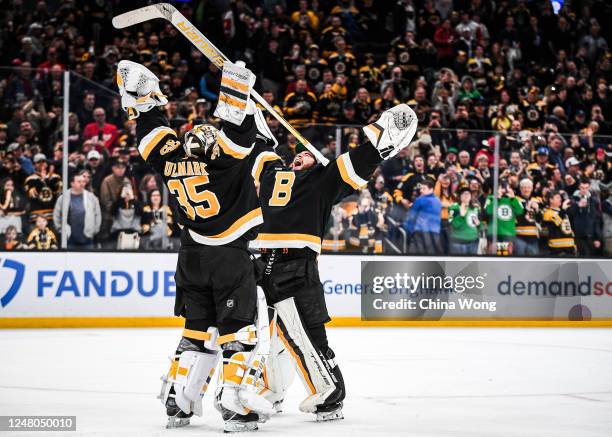 Jeremy Swayman the Boston Bruins celebrates a win against the Detroit Red Wings with Linus Ullmark at TD Garden on March 11, 2023 in Boston,...