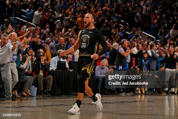 Stephen Curry of the Golden State Warriors celebrates the game-tying shot against the Milwaukee Bucks on March 11, 2023 at Chase Center in San...