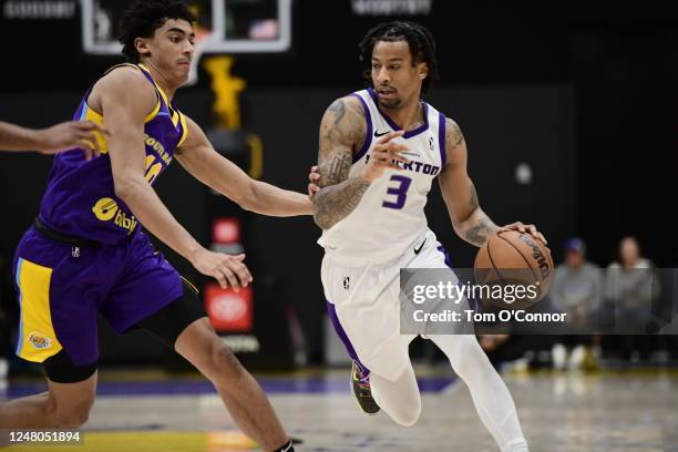 Trey Burke of Stockton dribbles around Max Christie of South Bay on March 11, 2023 at UCLA Heath Training Center in El Segundo, California. NOTE TO...