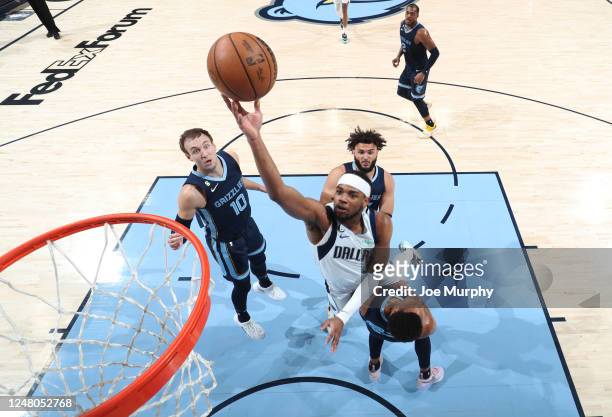 Jaden Hardy of the Dallas Mavericks drives to the basket during the game against the Memphis Grizzlies on March 11, 2023 at FedExForum in Memphis,...