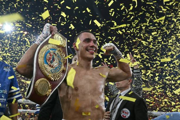 Australian boxer Tim Tszyu celebrates victory over USA's Tony Harrison in their WBO super welterweight world title bout at Qudos Bank Arena in Sydney...