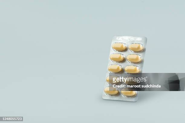 capsules pill in blister packaging. - blister package stock pictures, royalty-free photos & images