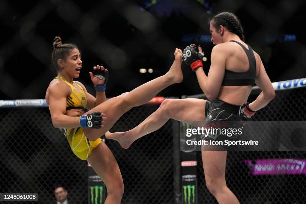 Jessica Penne battles Tabatha Ricci in their Women's Strawweight fight during the UFC 285 event at T-Mobile Arena on March 4, 2023 in Las Vegas, NV,...