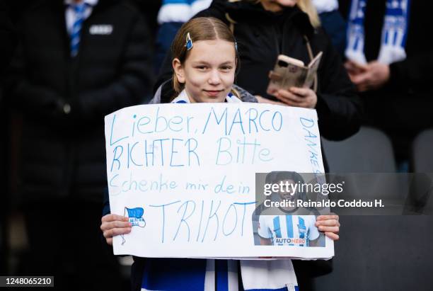 Young female fan holding up a sign asking for the jersey of Marco Richter during the Bundesliga match between Hertha BSC and 1. FSV Mainz 05 at...