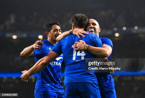 England , United Kingdom - 11 March 2023; Damian Penaud of France celebrates with teammates Yoram Moefana, left, and Maxime Lucu after scoring his...