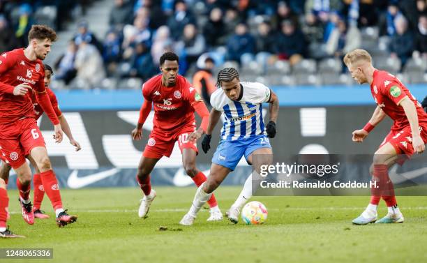 Jessic Ngamkam of Hertha BSC takes on three players of 1. FSV Mainz 05 during the Bundesliga match between Hertha BSC and 1. FSV Mainz 05 at...