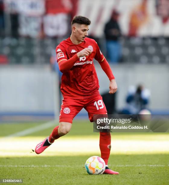 Anthony Caci of 1. FSV Mainz 05 passes the ball during the Bundesliga match between Hertha BSC and 1. FSV Mainz 05 at Olympiastadion on March 11,...