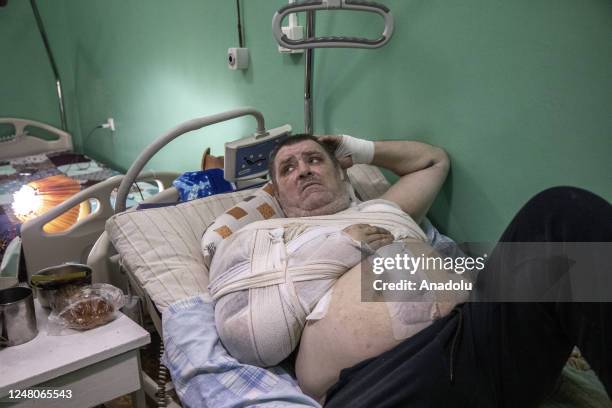 Valery, 53-year-old, lays on a bed in Konstantinivka Hospital, after he arrived with multiple injures caused by an explosion while he was in Bakhmut...