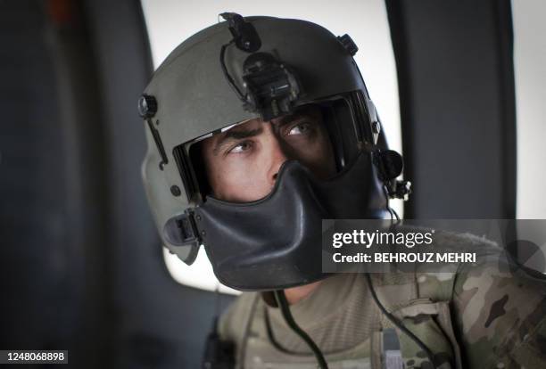 Flight Medic Officer,Staff Sergeant Noah Berg from U.S. Army's Task Force Lift "Dust Off", Charlie Company 1-171 Aviation Regiment checks the heart...