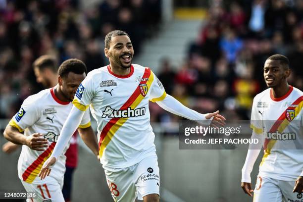 Lens French forward Alexis Claude Maurice celebrates with teammates after scoring a fourth goal for his team during the French L1 football match...