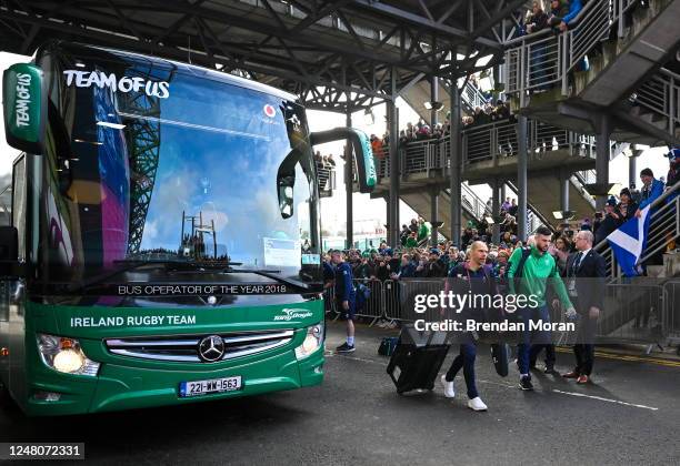 Scotland , United Kingdom - 12 March 2023; Robbie Henshaw of Ireland and strength and conditioning coach Jason Cowman arrive before the Guinness Six...