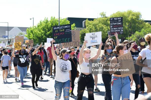 Protestors march at the Glendale Community March and Vigil for Black Lives Matter on June 07, 2020 in Glendale, California.