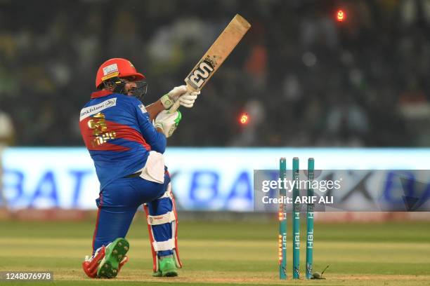 Karachi Kings' Imad Wasim is clean bowled during the Pakistan Super League Twenty20 cricket match between Karachi Kings and Lahore Qalandars at the...