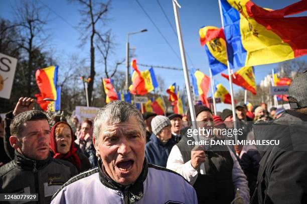Moldovan demonstrators attend a protest organized by a Moldovan member of parliament on behalf of the "Sor" opposition party in Chisinau on March 12,...