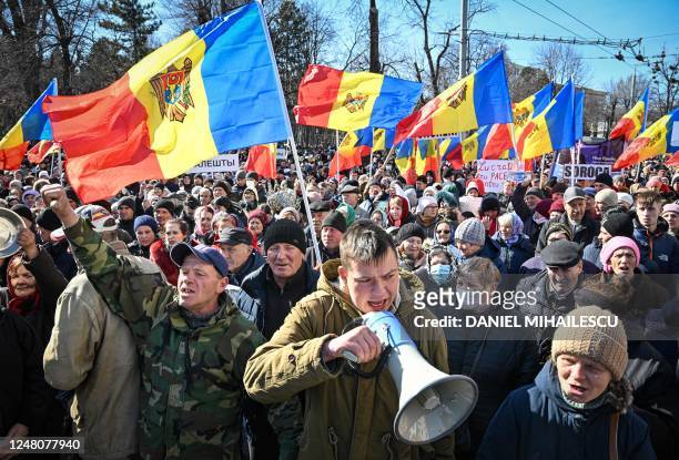 Moldovan demonstrators hold Moldova national flags during a protest organized by a Moldovan member of parliament on behalf of the "Sor" opposition...