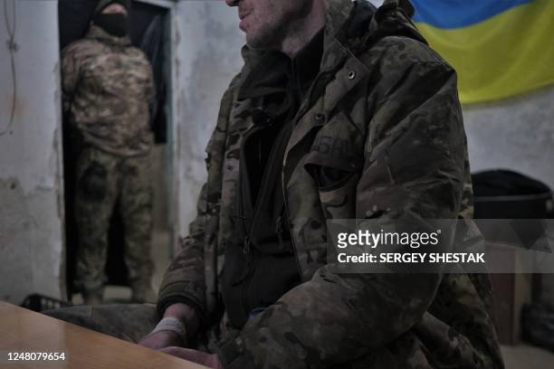 Member of the Russian paramilitary group Wagner and former criminal prisoner sits in the interrogation room after being captured by Ukrainian...
