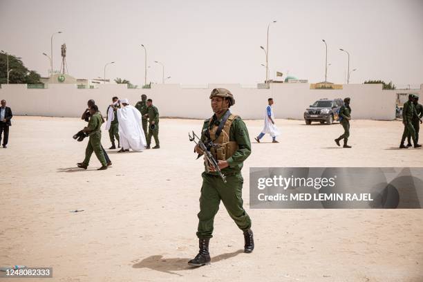 Mauritanian soldiers stand guard during the funeral of Mauritanian police officer Mustapha Ould El Khadir Ould Abeid at the Ibn Abbas Mosque in...
