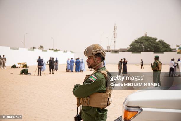 Mauritanian soldiers stand guard during the funeral of Mauritanian police officer Mustapha Ould El Khadir Ould Abeid at the Ibn Abbas Mosque in...