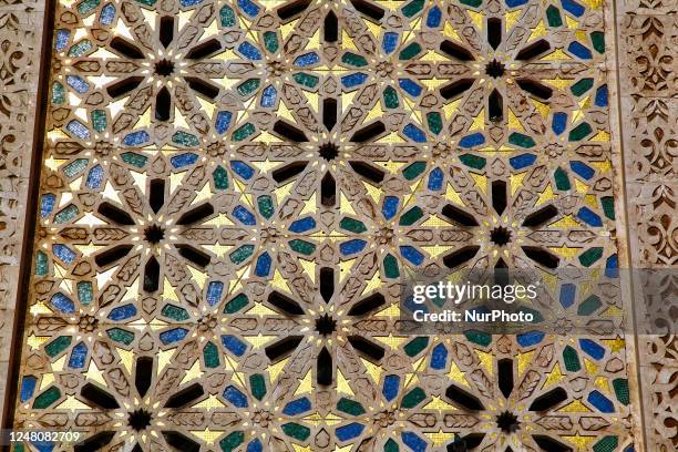 Ornate mosaic pattern adorns exterior of the Hassan II Mosque in the city of Casablanca, Morocco, Africa. Hassan II Mosque is the largest mosque in...