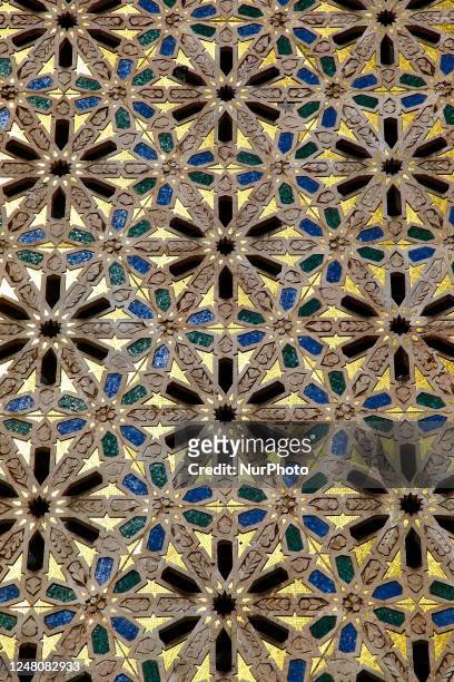 Ornate mosaic pattern adorns exterior of the Hassan II Mosque in the city of Casablanca, Morocco, Africa. Hassan II Mosque is the largest mosque in...