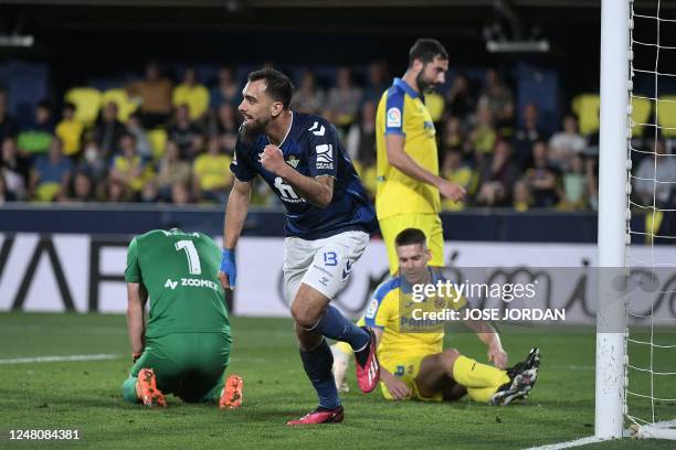 Real Betis' Spanish forward Borja Iglesias celebrates scoring his team's first goal during the Spanish league football match between Villarreal CF...