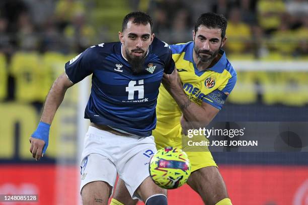 Real Betis' Spanish forward Borja Iglesias vies with Villarreal's Spanish defender Raul Albiol during the Spanish league football match between...