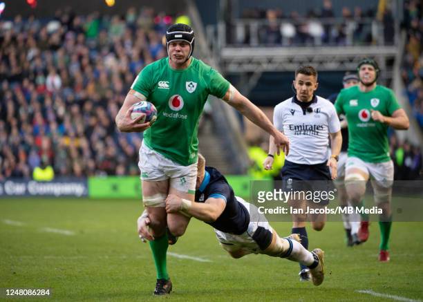 Ireland 2nd Row, James Ryan, is tackled just short of the line during the Six Nations Rugby match between Scotland and Ireland at Murrayfield Stadium...