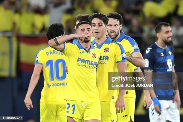 Villarreal's Spanish forward Yeremi Pino celebrates with teammates scoring his team's first goal during the Spanish league football match between...