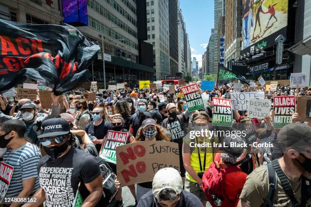 Thousands of protesters wearing masks and holding signs crowd into Times Square to support Black Lives Matter. This was part of the Black Lives...