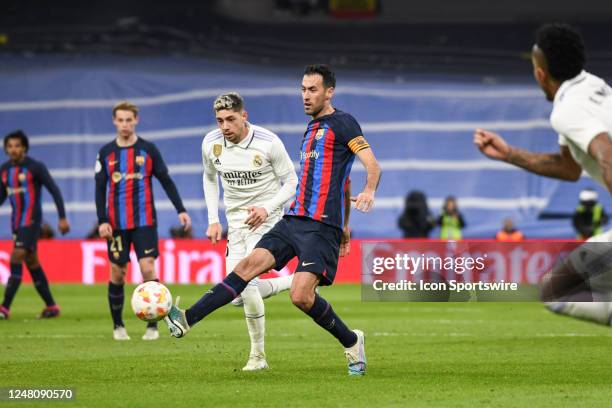 Barcelona Sergio Busquets passes the ball during the Copa Del Rey match between FC Barcelona and Real Madrid CF on March 2 at Santiago Bernabeu...