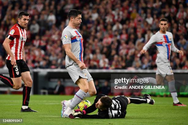 Barcelona's Polish forward Robert Lewandowski vies with Athletic Bilbao's Spanish goalkeeper Julen Agirrezabala during the Spanish league football...