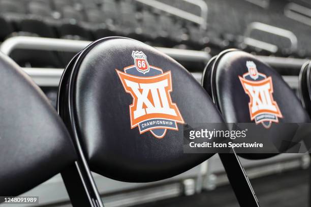View of the Big 12 logo on chairs before a Big 12 Tournament semifinal basketball game between the Iowa State Cyclones and Kansas Jayhawks on March...