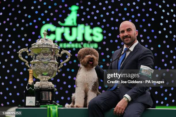 Orca the Lagotto Romagnolo with handler Javier Gonzalez Mendikote who has won Best in Show during the fourth day of the Crufts Dog Show at the...