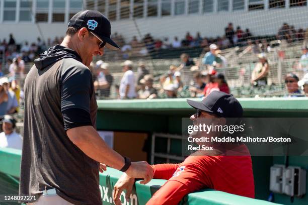 Aaron Boone of the New York Yankees reacts with Andy Fox of the Boston Red Sox before during a Grapefruit League game on March 12, 2023 at JetBlue...