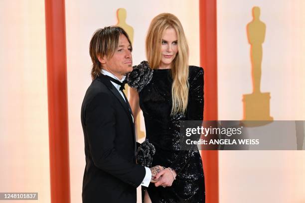 Australian-US musician Keith Urban and his wife US-Australian actress Nicole Kidman attend the 95th Annual Academy Awards at the Dolby Theatre in...