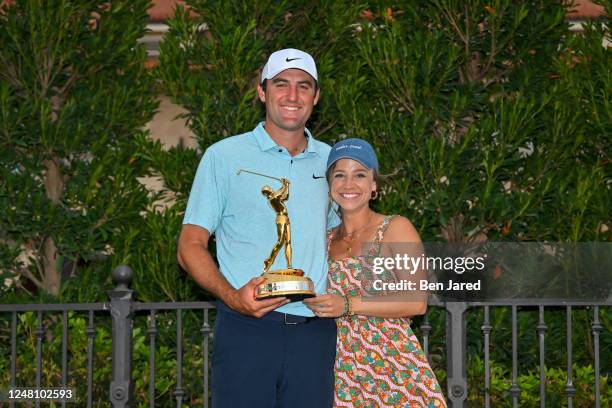Scottie Scheffler poses for a photo with his wife Meredith after winning during the trophy ceremony during the final round of THE PLAYERS...