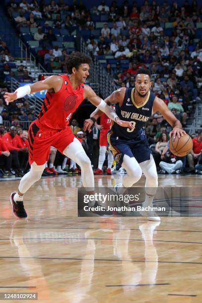 McCollum of the New Orleans Pelicans moves the ball during the game against the Portland Trail Blazers on March 12, 2023 at the Smoothie King Center...