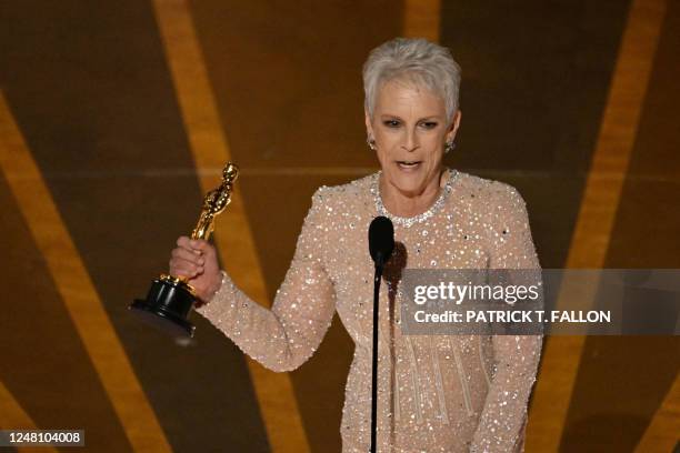 Actress Jamie Lee Curtis accepts the Oscar for Best Actress in a Supporting Role for "Everything Everywhere All at Once" onstage during the 95th...