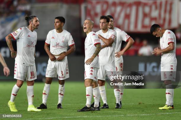 Rodrigo Castro, Lucas Carrizo, Federico Fattori, Santiago Hezze and Valentin Burgoa of Huracan react after losing a match between Estudiantes and...