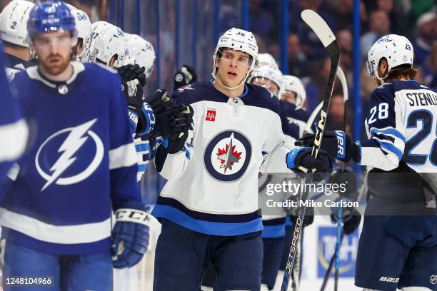 Morgan Barron of the Winnipeg Jets, center, celebrates his goal against the Tampa Bay Lightning during the second period of a hockey game at the...