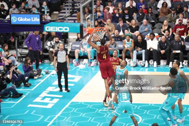 Evan Mobley of the Cleveland Cavaliers dunks the ball during the game against the Charlotte Hornets on March 12, 2023 at Spectrum Center in...