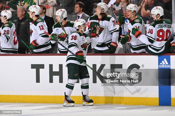 Mats Zuccarello of the Minnesota Wild celebrates with teammates on the bench after scoring a goal against the Arizona Coyotes during the first period...