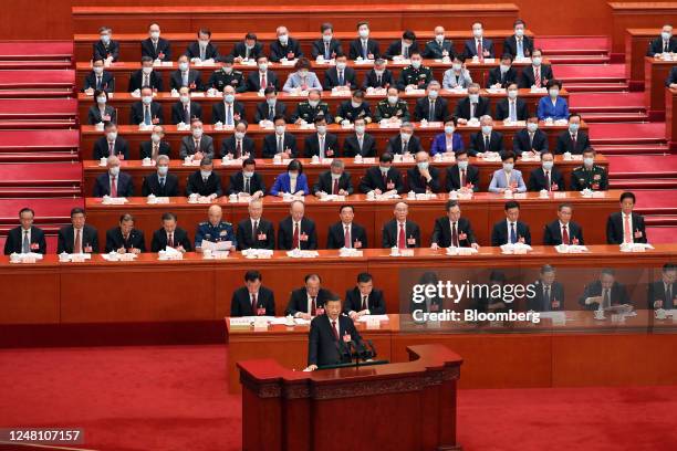 Xi Jinping, China's president, bottom center, speaks during the closing session of the First Session of the 14th National People's Congress at the...