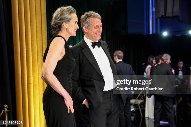 Andie MacDowell and Hugh Grant, backstage at the 95th Academy Awards at the Dolby Theatre on March 12, 2023 in Hollywood, California.