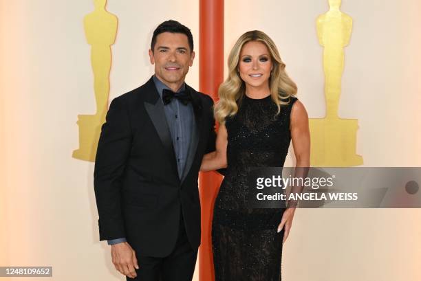Actor Mark Consuelos and his wife TV host Kelly Ripa attend the 95th Annual Academy Awards at the Dolby Theatre in Hollywood, California on March 12,...