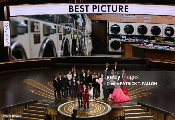 Director Daniel Scheinert and US director Daniel Kwan speak after winning the Oscar for Best Picture for "Everything Everywhere All at Once" onstage...